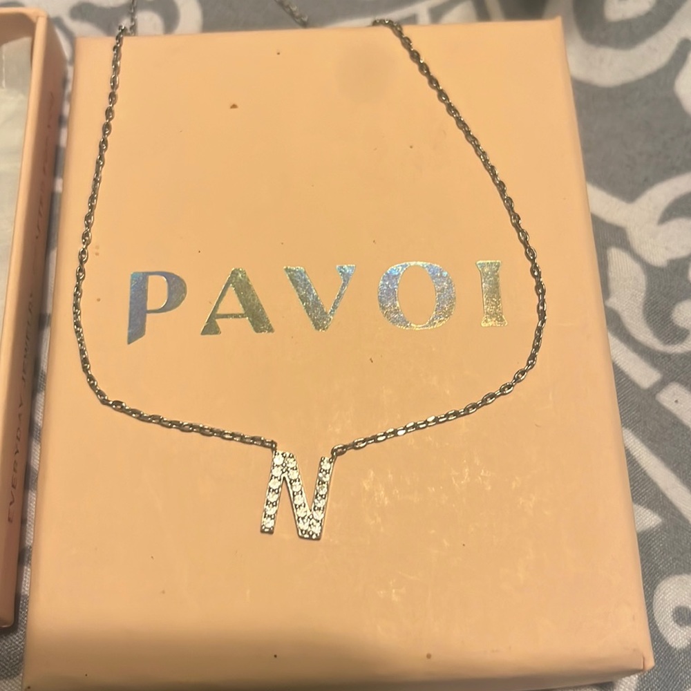 Pavoi silver necklace with the letter N charm. Comes with all the packaging.